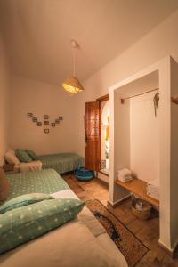 Uma cama ou camas num quarto em Riad Dari