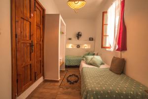 Uma cama ou camas num quarto em Riad Dari