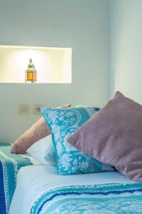 Uma cama ou camas num quarto em Riad Dari