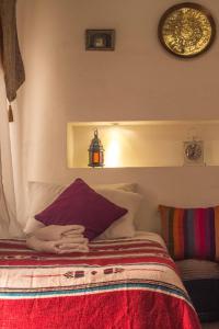 Uma cama ou camas num quarto em Riad Dari