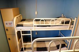 A bunk bed or bunk beds in a room at Busan Sukbak Dot Com Guesthouse