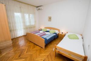 Postel nebo postele na pokoji v ubytování Apartment Zlatko