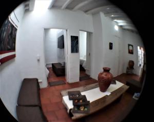 a view of a living room with a vase at Casa-Arbol in Bogotá