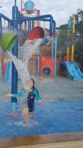 a young boy in the water at a water park at My Resort Hua Hin E306 in Hua Hin