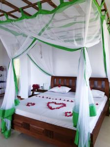 Кровать или кровати в номере Simba House