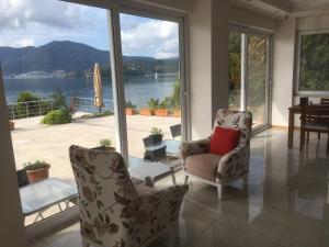 a living room with a view of the water at Sovalye Hotel in Fethiye
