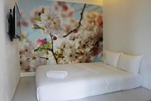 Postel nebo postele na pokoji v ubytování V Garden Hotel