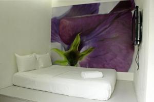 Postel nebo postele na pokoji v ubytování V Garden Hotel