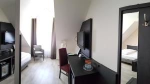 TV a/nebo společenská místnost v ubytování Astralis Hotel Domizil