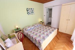 Postel nebo postele na pokoji v ubytování Guest House Milotic