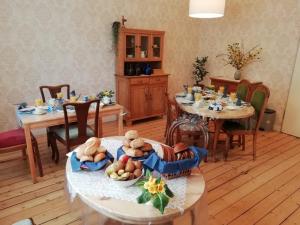 a dining room with two tables with teddy bears on them at Altstadtpension Hameln in Hameln