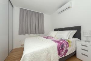 Postel nebo postele na pokoji v ubytování Penthouse Jure