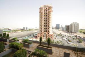 a view of a city with a tall building at SHH -Furnished Studio Apartment in Matrix Tower, Sports City in Dubai