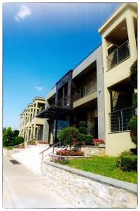 a building with balconies on the side of it at Kristonia Hotel Suites in Kilkis