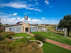 a building with a water tower on top of it at Hotel @ Secunda in Secunda