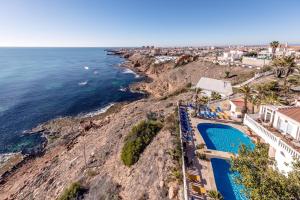 an aerial view of the ocean and a resort at Hotel Masa International in Torrevieja