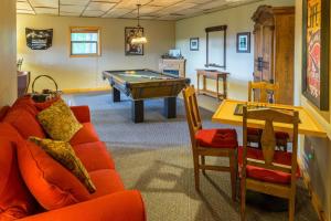 a living room with a couch and a pool table at 3 Bed 3 Bath Vacation home in Sylva in Sylva