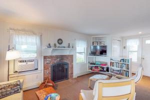 a living room with a fireplace and a tv at 2 Bed 1 Bath Vacation home in Eastham in Eastham