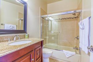 a bathroom with a sink and a shower and a toilet at Ocean Beach Cliffs Sanctuary Oceanfront cottage w/unobstructed views & deck: steps to the water in San Diego +22 photos