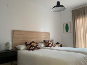 Posteľ alebo postele v izbe v ubytovaní Apartamento Tarifa - zona 10!Piscina(parking incl)