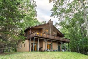 a house in the woods with a wrap around porch at 3 Bed 3 Bath Vacation home in Sylva in Sylva