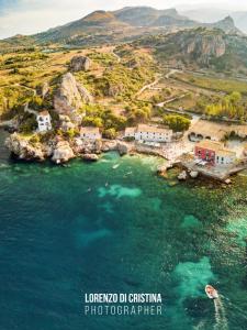 an aerial view of a small island in the water at DE MEO Guest House in Castellammare del Golfo