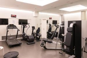 a gym with treadmills and cardio equipment in a room at Saidoff Luxury Residence in Jerusalem