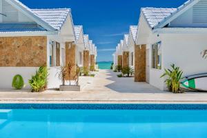 a villa with a swimming pool in a resort at So KohKoon Beach Resort in Bang Rak Beach