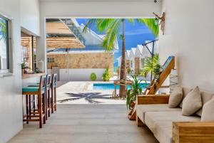 a living room with a couch and a table at So KohKoon Beach Resort in Bang Rak Beach