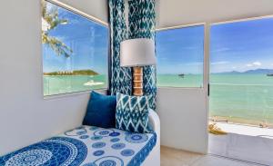 a room with a view of the ocean at So KohKoon Beach Resort in Bang Rak Beach