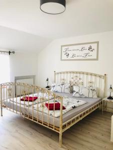 a bedroom with two beds with white walls at Agnieszkas Pension in Havelberg