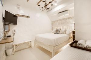 Säng eller sängar i ett rum på Lugar Bonito Hotel