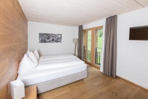 Postel nebo postele na pokoji v ubytování Hotel Reuti