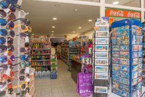 a store aisle with a lot of products on display at Lybian Sea in Kalamaki