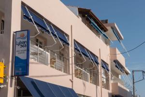 a building with solar panels on the side of it at Lybian Sea in Kalamaki