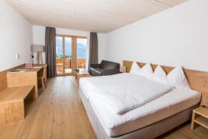 Postel nebo postele na pokoji v ubytování Hotel Reuti