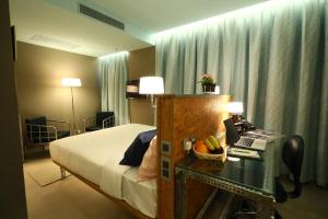 Postel nebo postele na pokoji v ubytování IND Hotel