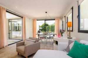 a living room with a couch and a table at Hort Petit de Ternelles Underfloor heating in Pollença