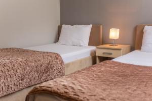 Postel nebo postele na pokoji v ubytování Hotel Hana