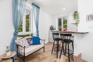 a living room with a bar and a couch at Apartment Villa Elena in Opatija