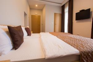 Postel nebo postele na pokoji v ubytování Hotel Hana