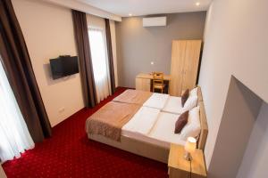 Postel nebo postele na pokoji v ubytování Hotel Hana