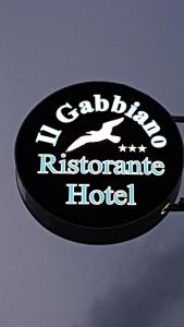 a sign for a hotel on the side of a vehicle at Hotel Ristorante Il Gabbiano in Cecina