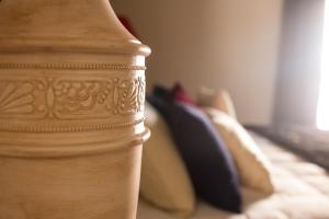 A bed or beds in a room at Residenza Palazzo Fortuna - Boutique Hotel