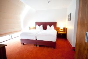 Business Hotel Ambio Gleisdorf客房内的一张或多张床位