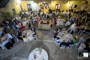 a group of people sitting at tables in a room at Il Casale Delle Rose in Caltagirone +102 photos