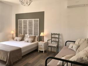 Postel nebo postele na pokoji v ubytování Ô 36 Rempart Sud B&B
