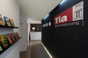 a hallway with a sign for the ica department store at Tia Apartments and Rooms in Zagreb