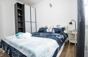 Posteľ alebo postele v izbe v ubytovaní Blue Pearl apartment