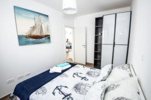Posteľ alebo postele v izbe v ubytovaní Blue Pearl apartment